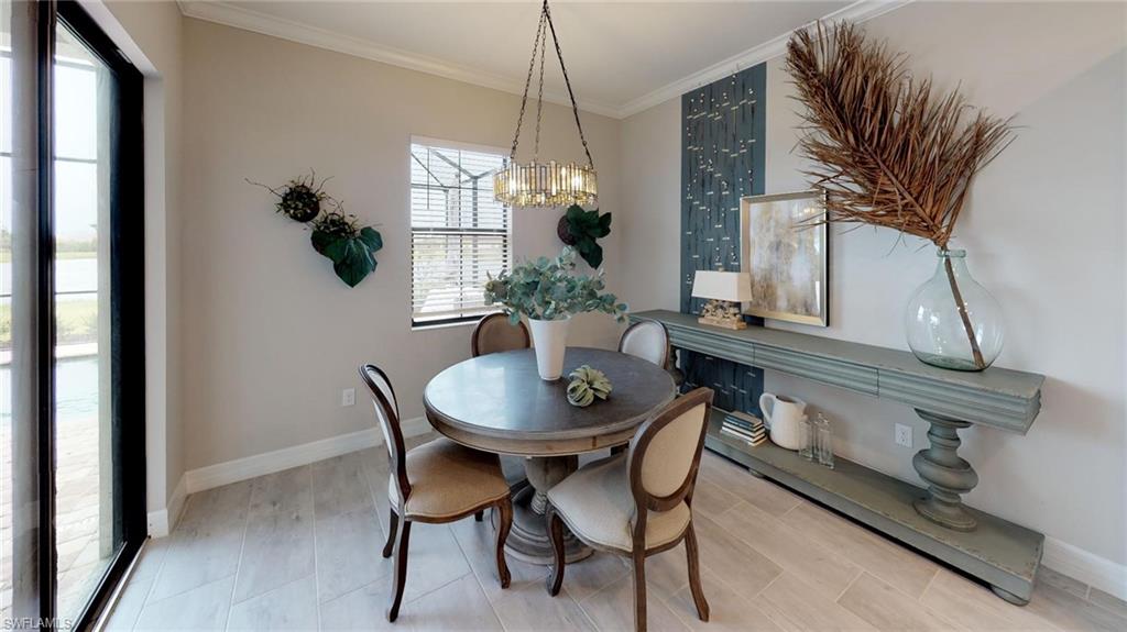 20259 Kingmont Drive Estero, FL 33928 - Photo 6 of 14 a dining room with furniture and window