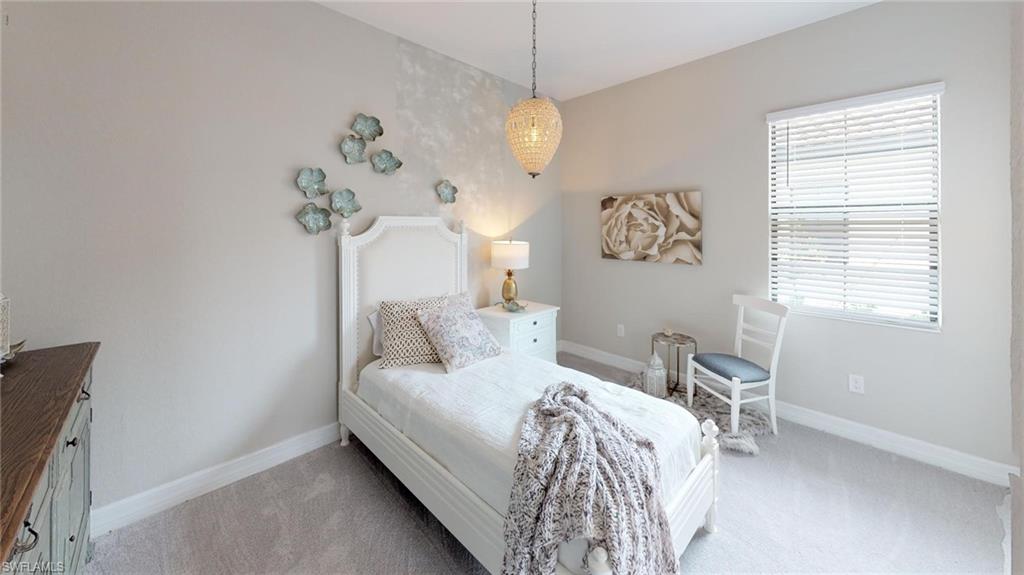 20259 Kingmont Drive Estero, FL 33928 - Photo 7 of 14 a bedroom with a bed and a window