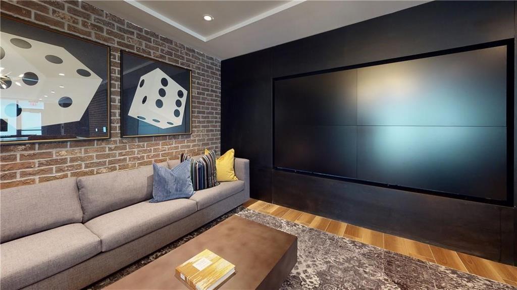 3651 Lenox Road Northeast, Unit B 05 Atlanta, GA 30305 - Photo 16 of 28 a living room with furniture and a flat screen tv