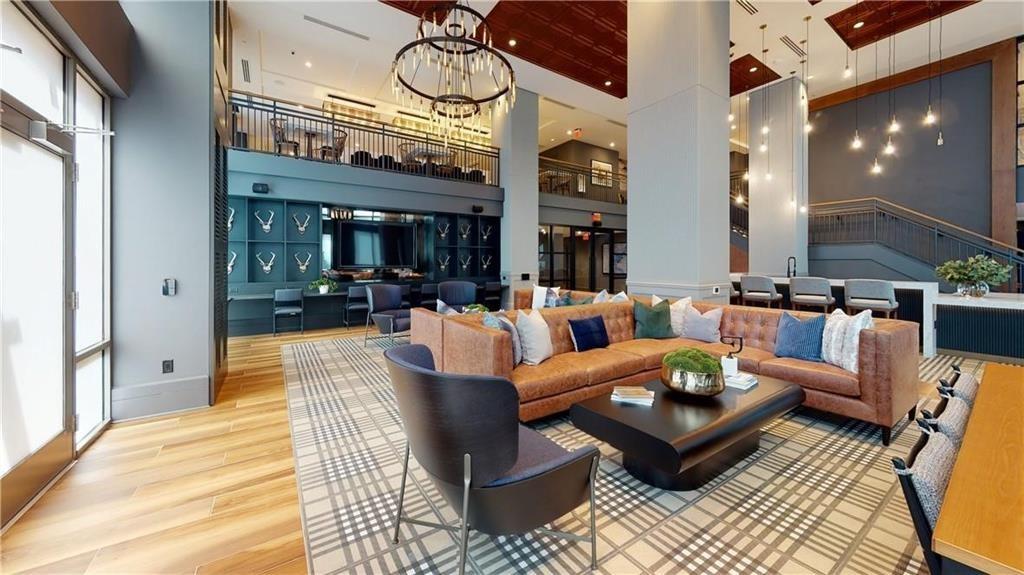 3651 Lenox Road Northeast, Unit B 05 Atlanta, GA 30305 - Photo 17 of 28 a living room with furniture kitchen view and a chandelier