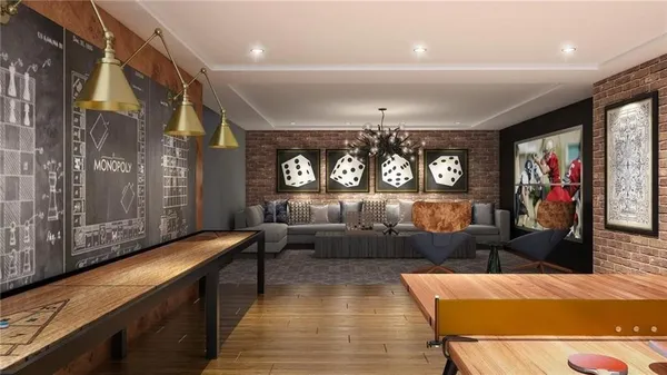 a living room with furniture and wooden floor