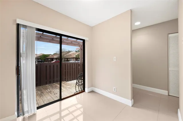 an empty room with sliding glass door