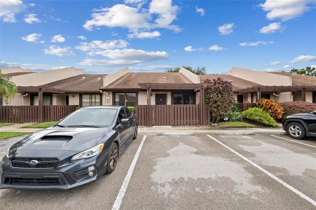a view of a car parked in front of house