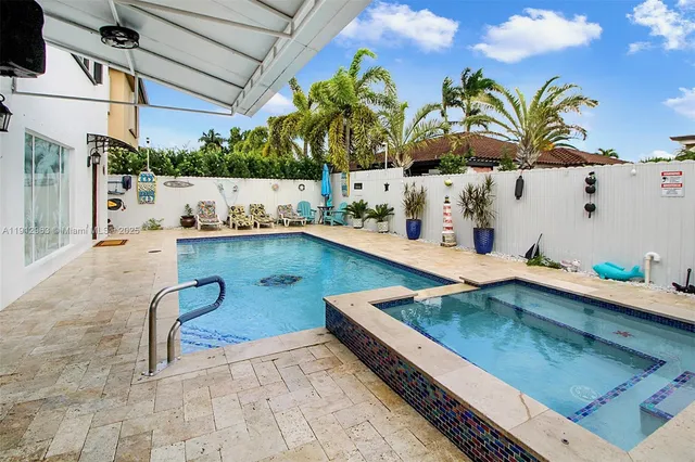 a view of a room with outdoor seating and plants