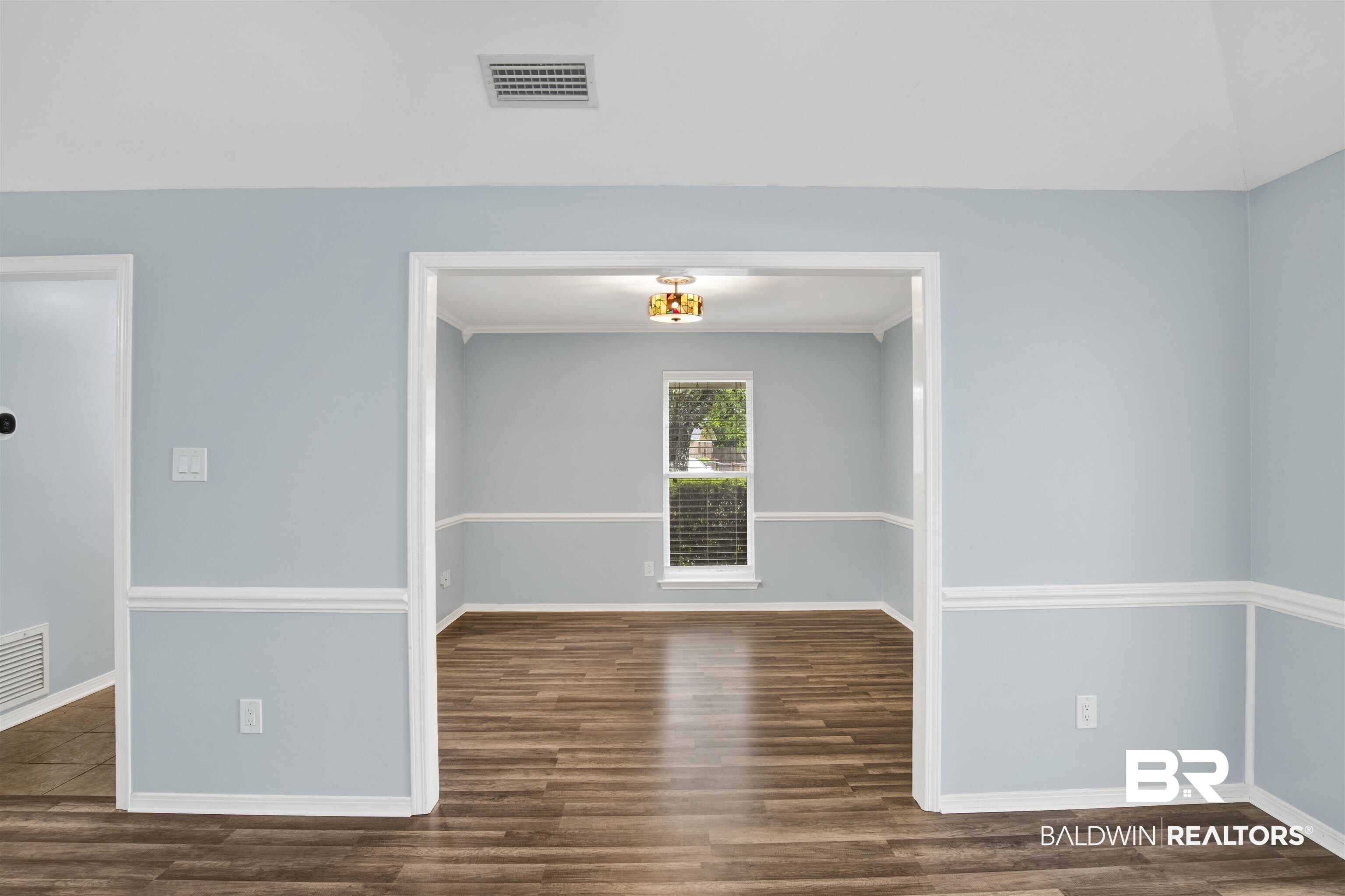 3011 Olde Gate Road Mobile, AL 36695 - Photo 13 of 35 Unfurnished room featuring wood finished floors and baseboards