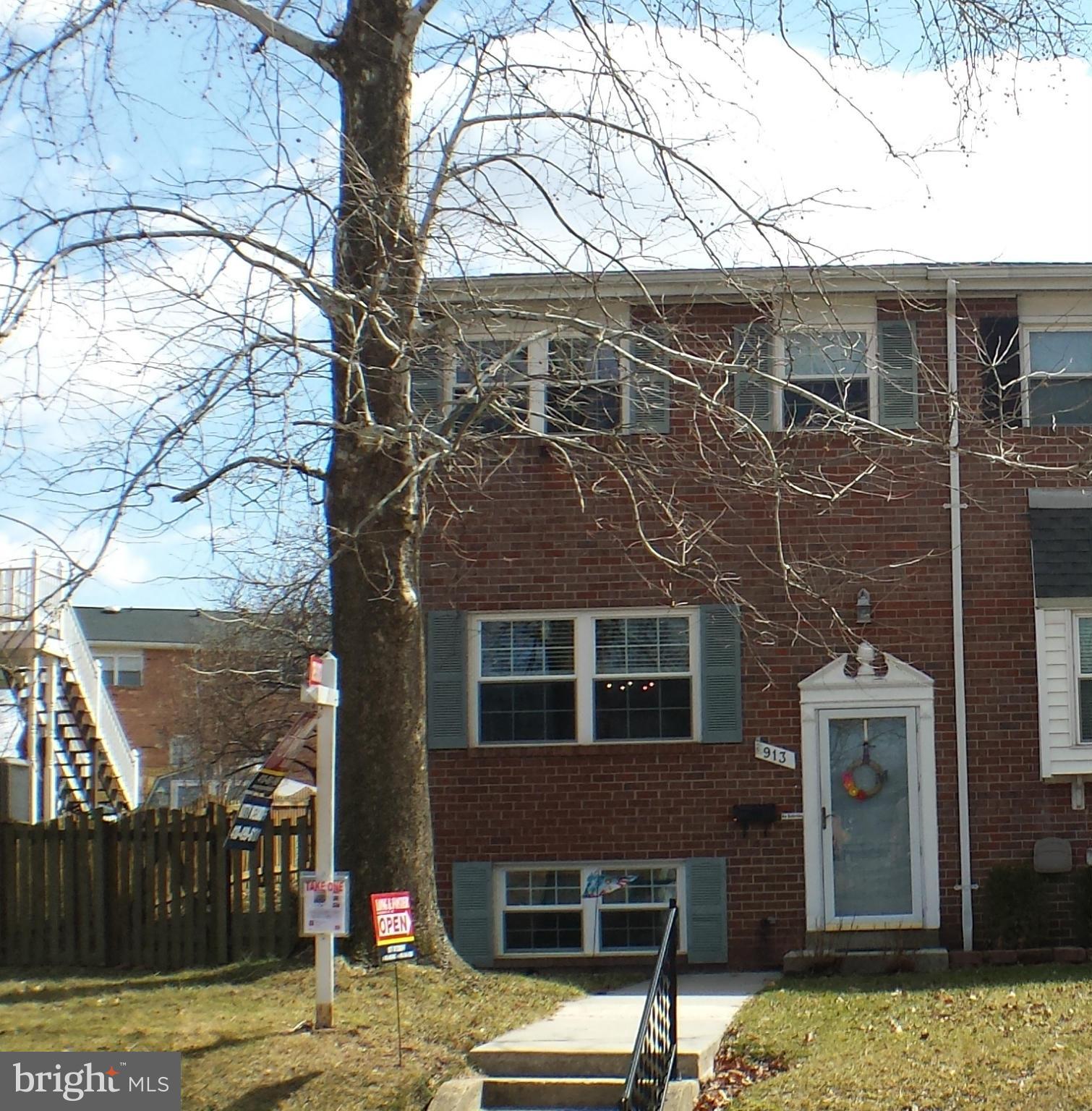 913 Elm Road Baltimore, MD 21227 - Photo 1 of 28 a front view of a house with parking