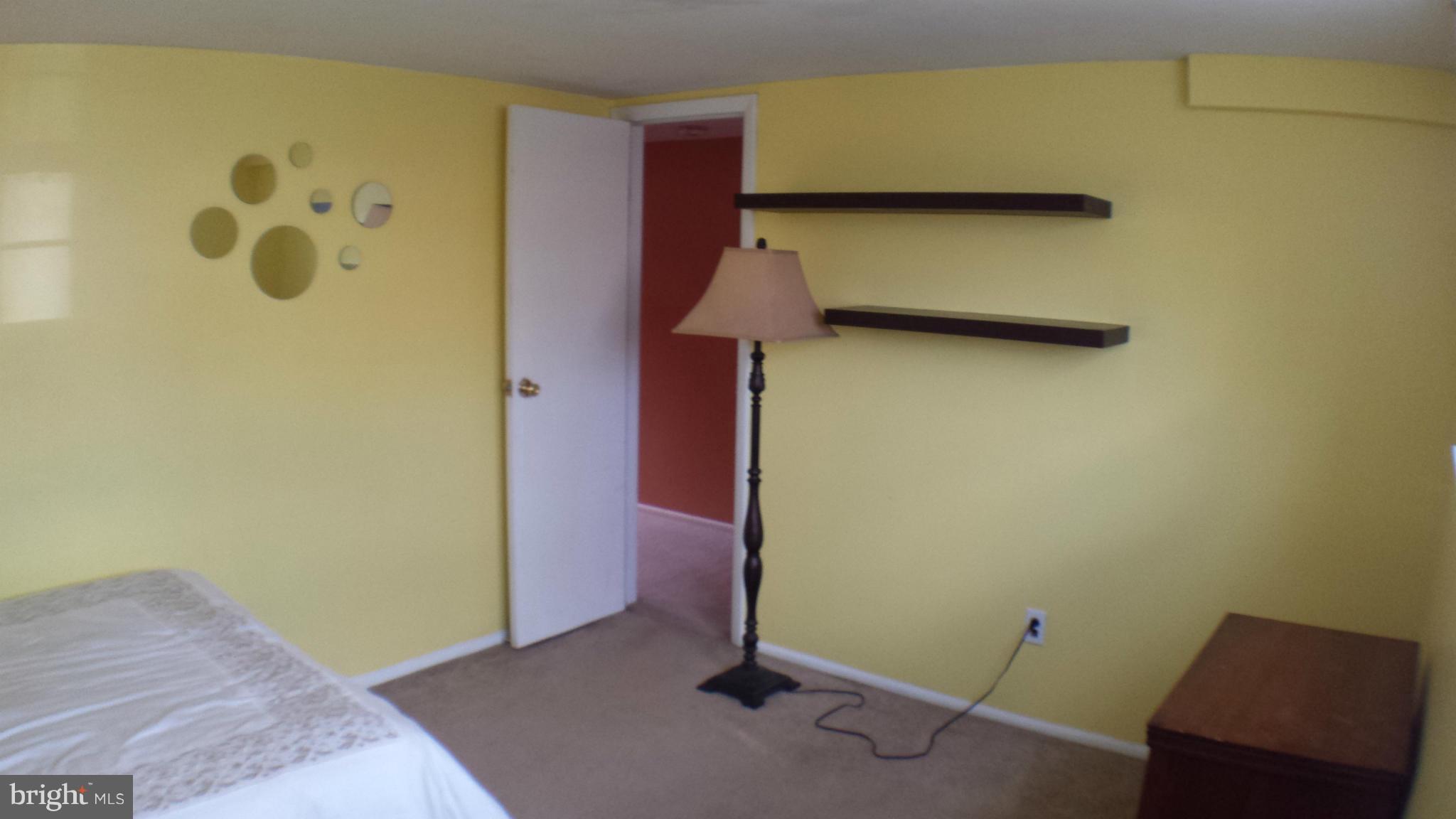 913 Elm Road Baltimore, MD 21227 - Photo 26 of 28 a view of a room with wooden floor and cabinet