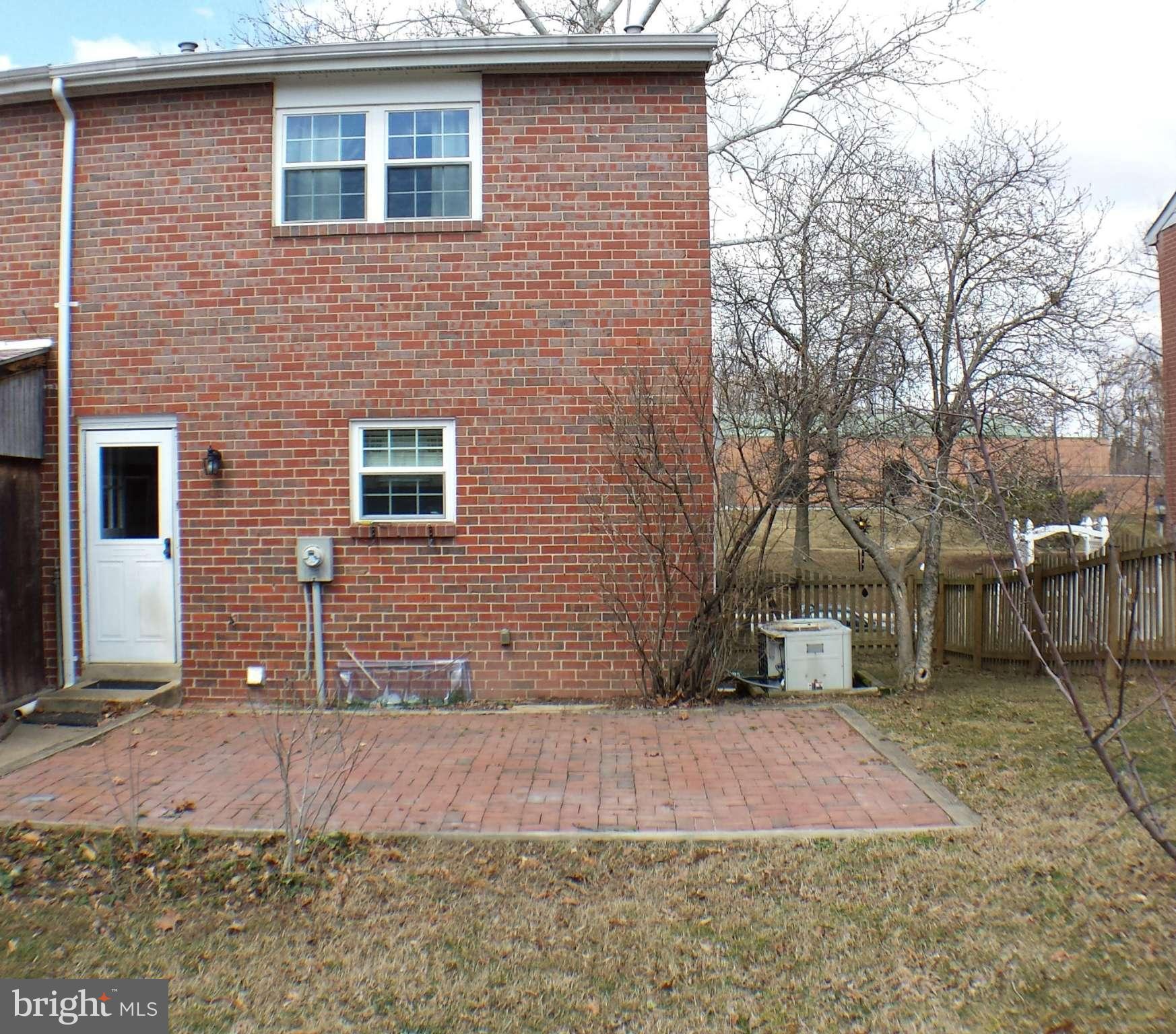913 Elm Road Baltimore, MD 21227 - Photo 27 of 28 a front view of a house with a yard