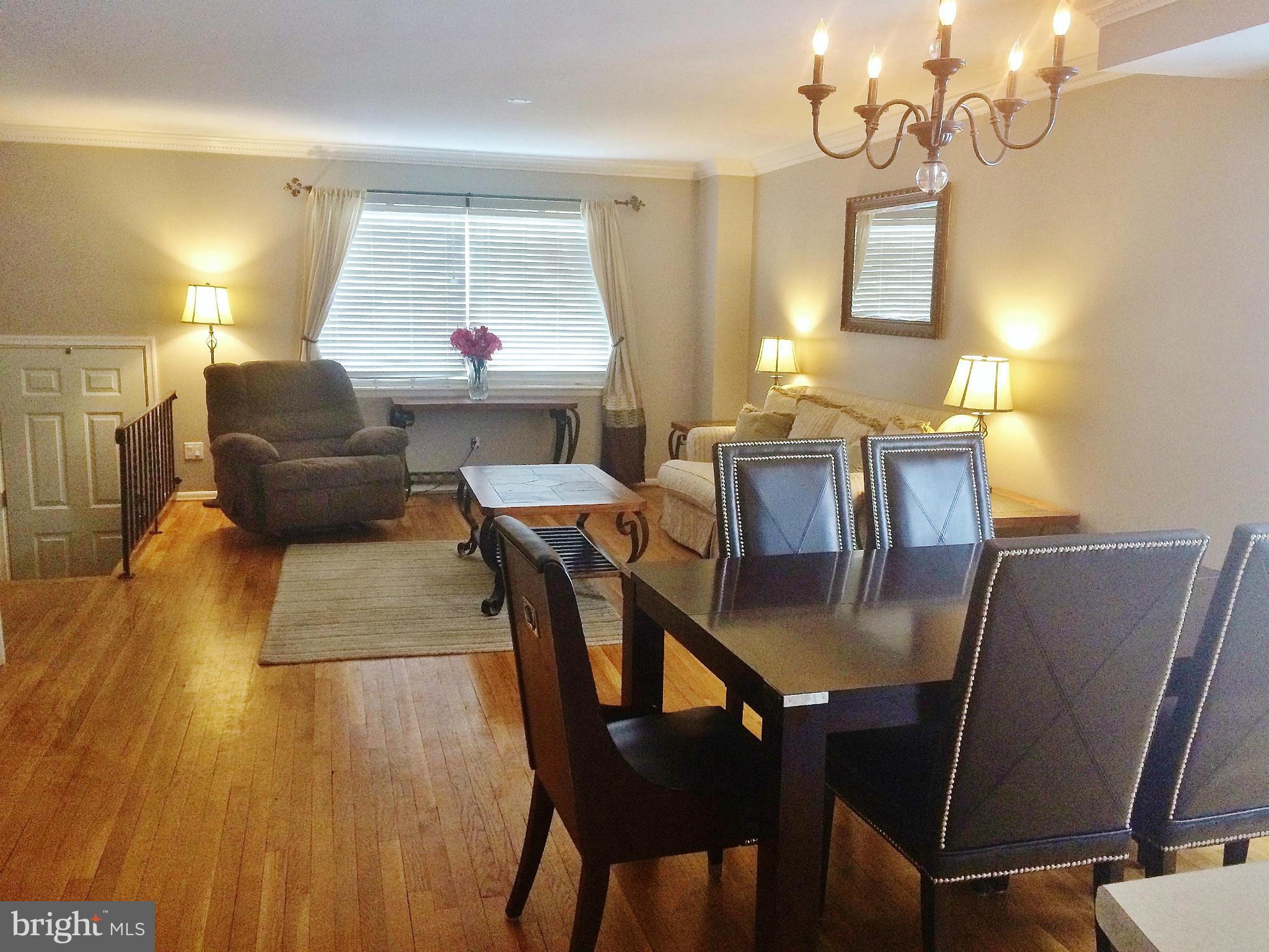 913 Elm Road Baltimore, MD 21227 - Photo 7 of 28 a dining room with furniture and window