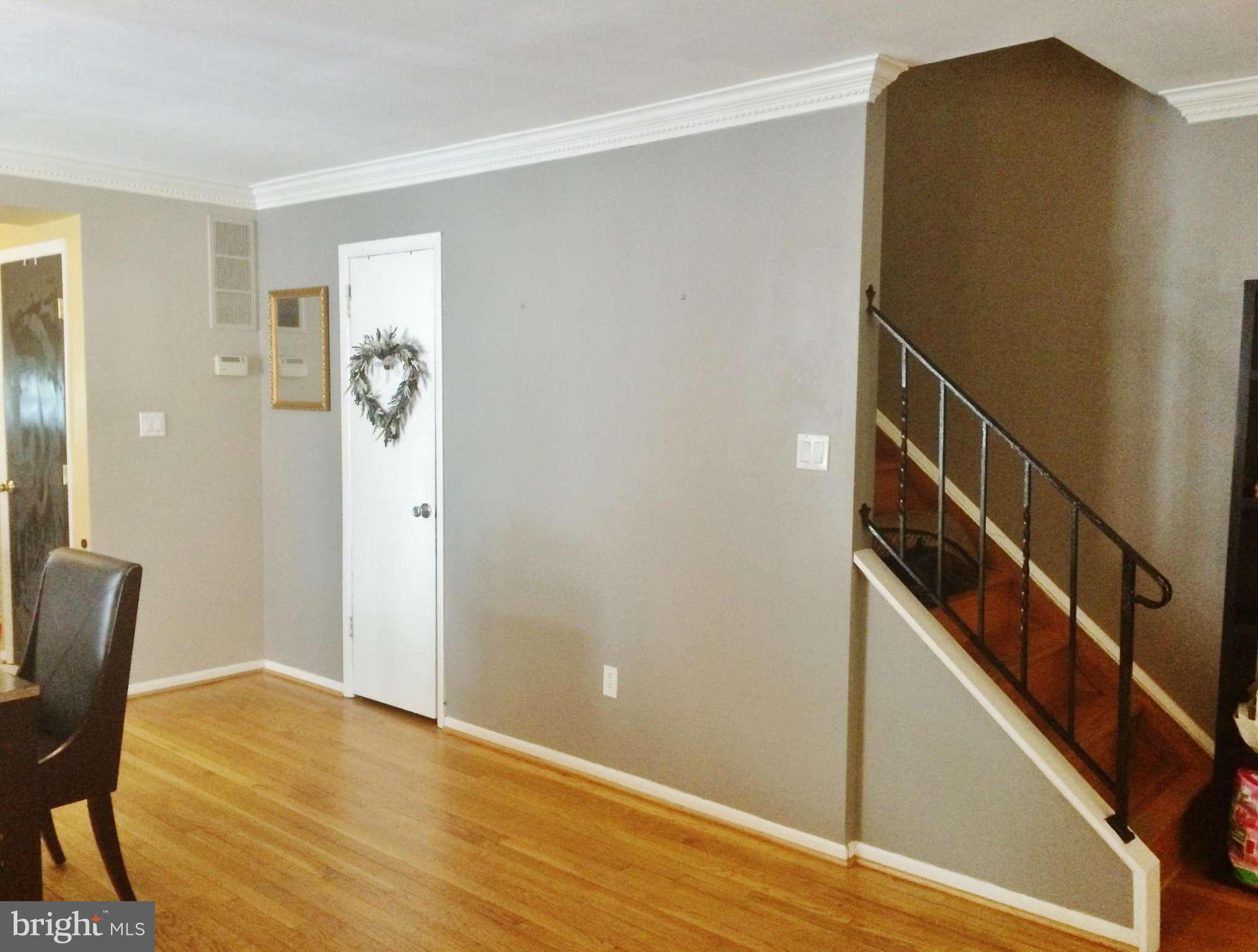 913 Elm Road Baltimore, MD 21227 - Photo 9 of 28 a view of a livingroom with furniture and stairs