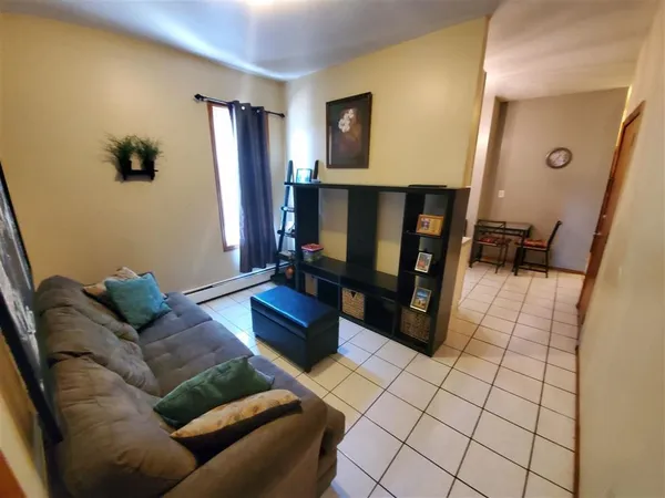 a living room with furniture and a table