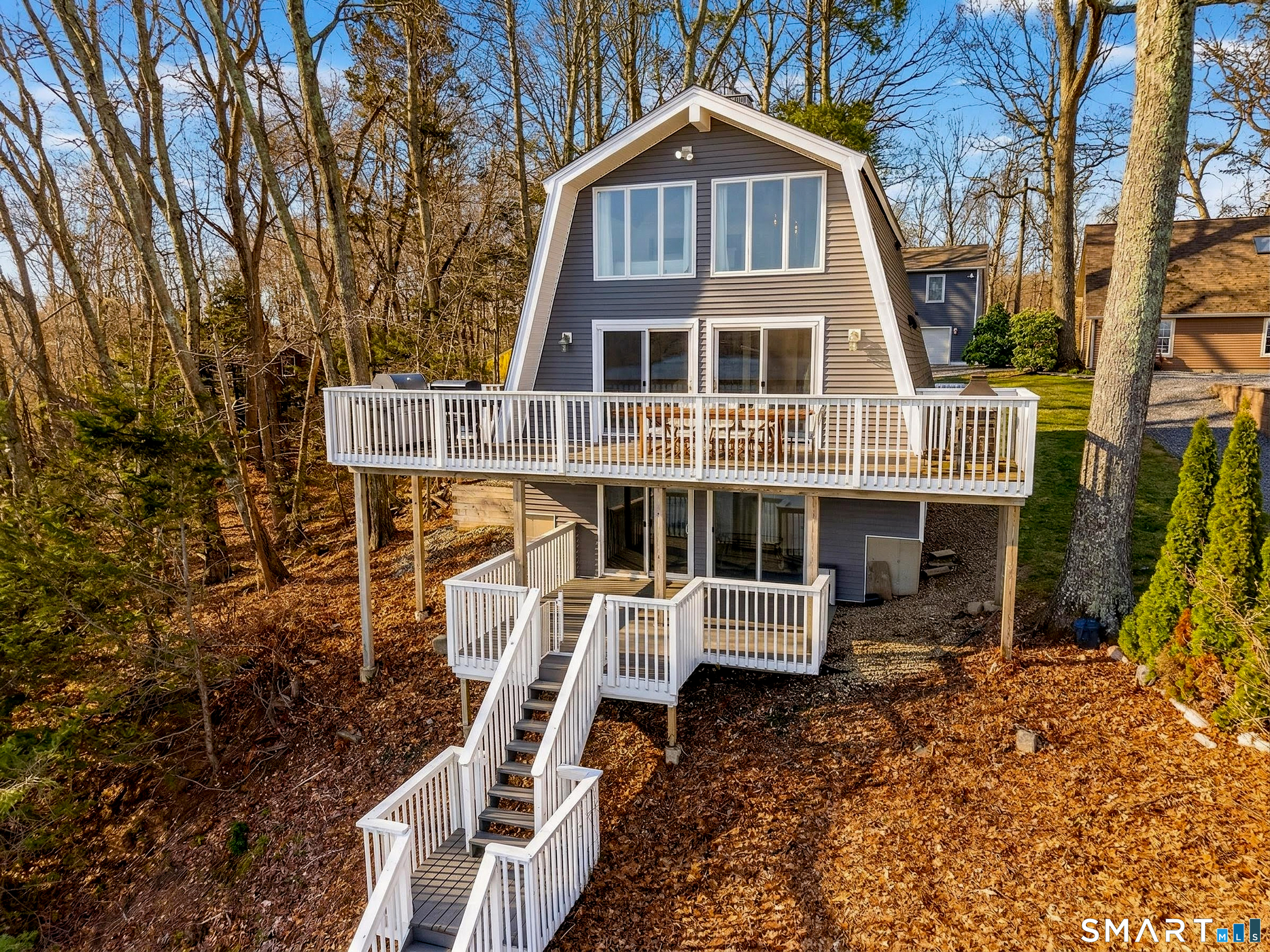 148 Old Colchester Road Salem, CT 06420 - Photo 2 of 40 Set up like a treehouse, each level provides jaw-dropping views of Gardner Lake