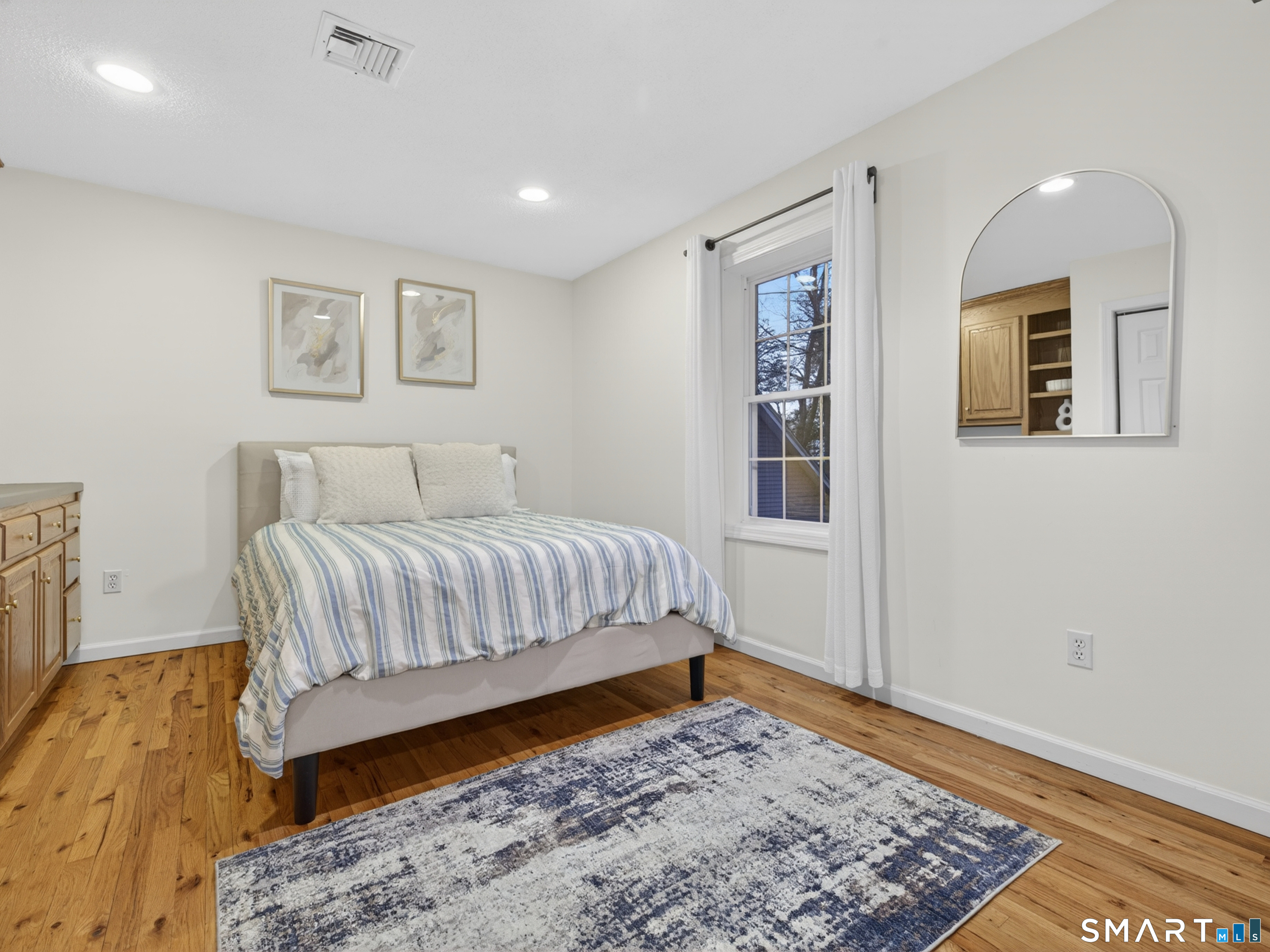 148 Old Colchester Road Salem, CT 06420 - Photo 36 of 40 Flexible use room with built-ins and hardwood floors