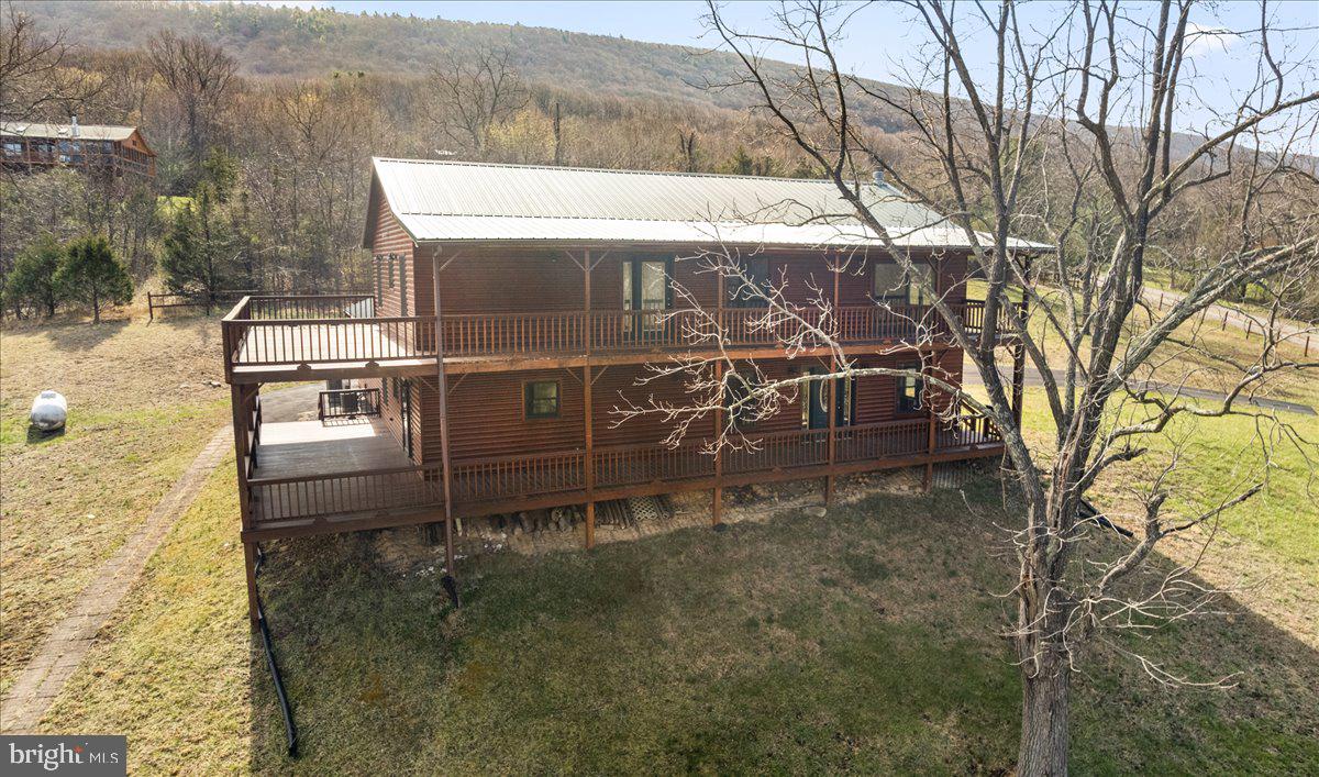 325 Coyote Run Mathias, WV 26812 - Photo 2 of 40 a small yard with wooden fence