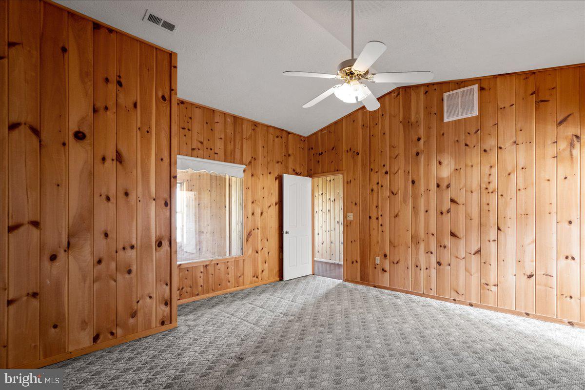 325 Coyote Run Mathias, WV 26812 - Photo 25 of 40 a view of a hallway with a chandelier fan