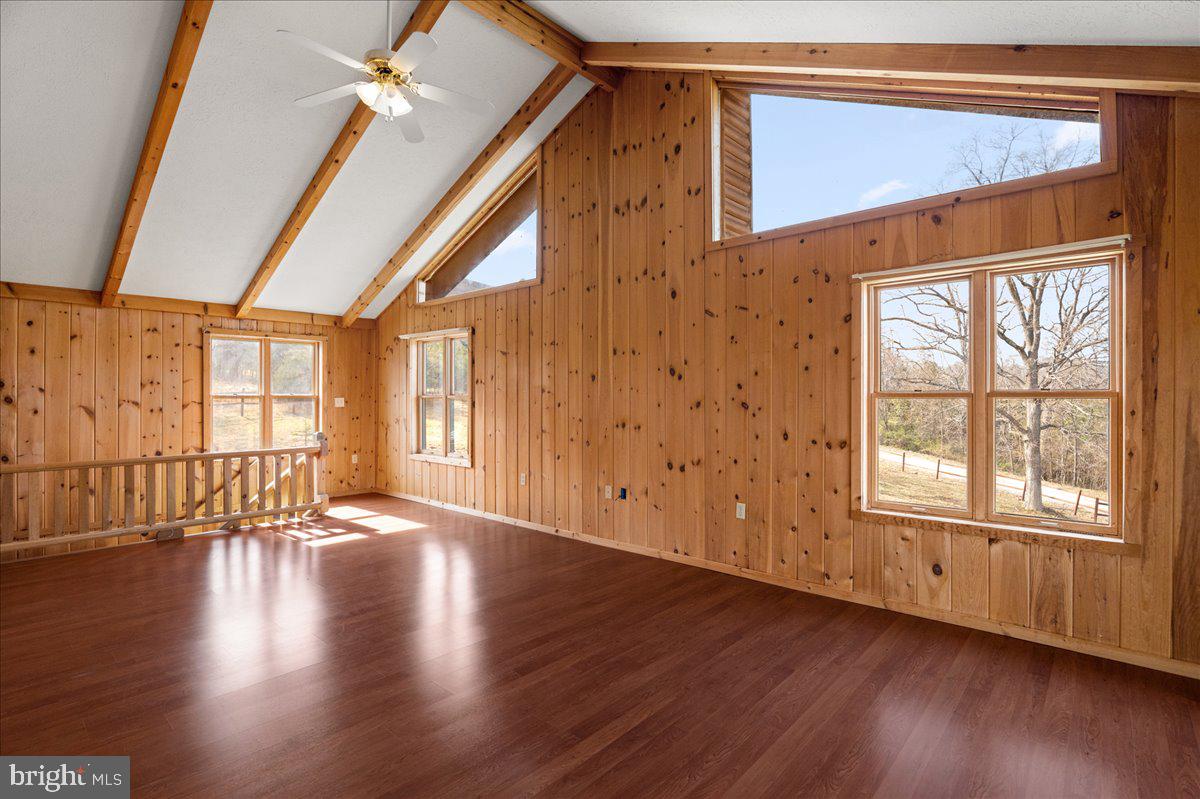325 Coyote Run Mathias, WV 26812 - Photo 28 of 40 a view of an empty room with wooden floor and a window