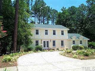 7104 Tanbark Way Raleigh, NC 27615 - Photo 1 of 1 front view of a house with a yard