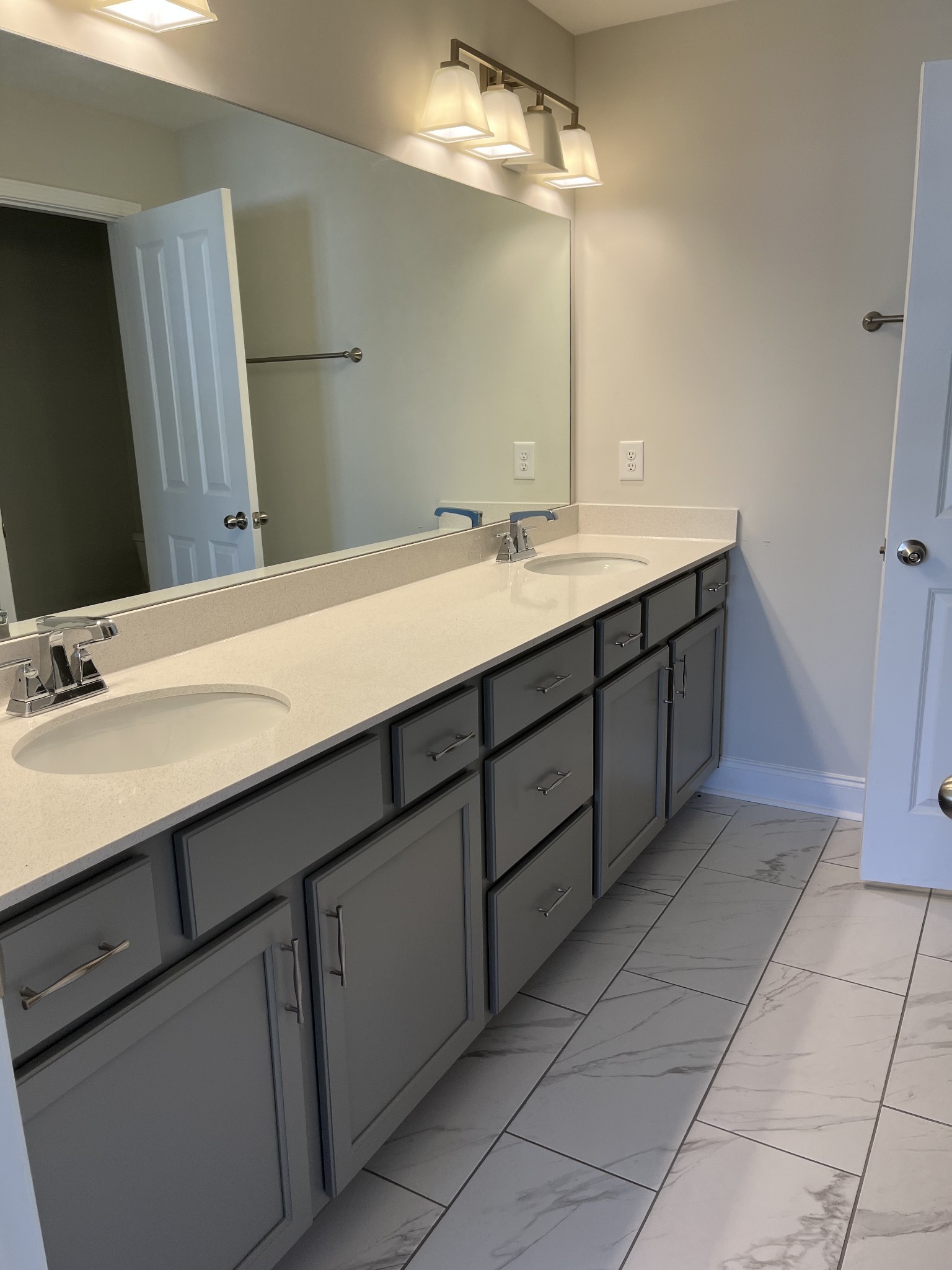 1078 June Wilde Ridge Spring Hill, TN 37174 - Photo 3 of 5 a bathroom with a double vanity sink and a mirror