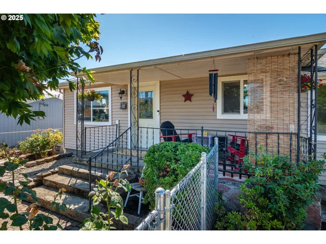 a view of a house with a flower garden