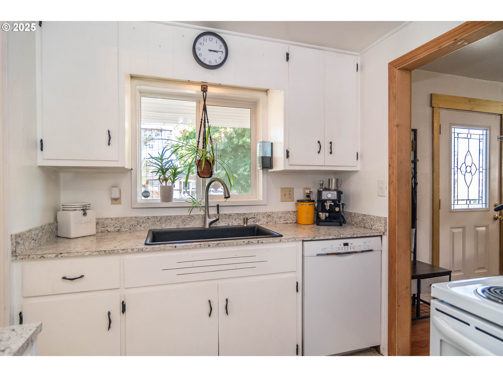 68 Rose Avenue Winston, OR 97496 - Photo 12 of 43 a kitchen with granite countertop a sink cabinets window and appliances