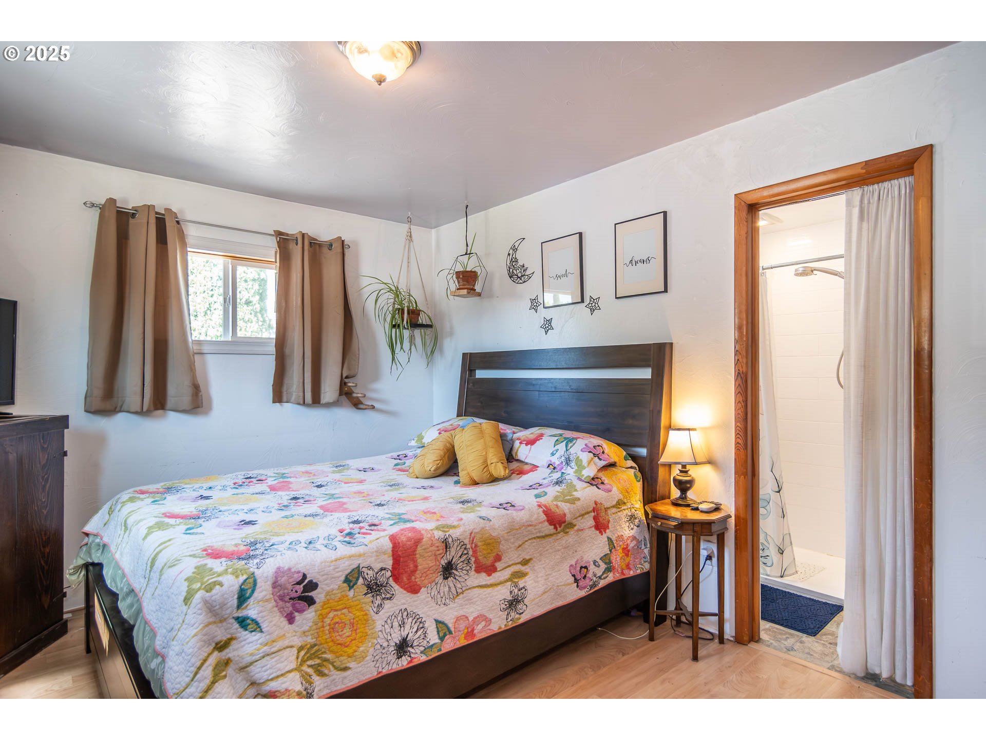 68 Rose Avenue Winston, OR 97496 - Photo 16 of 43 a bedroom with a bed and wooden floor