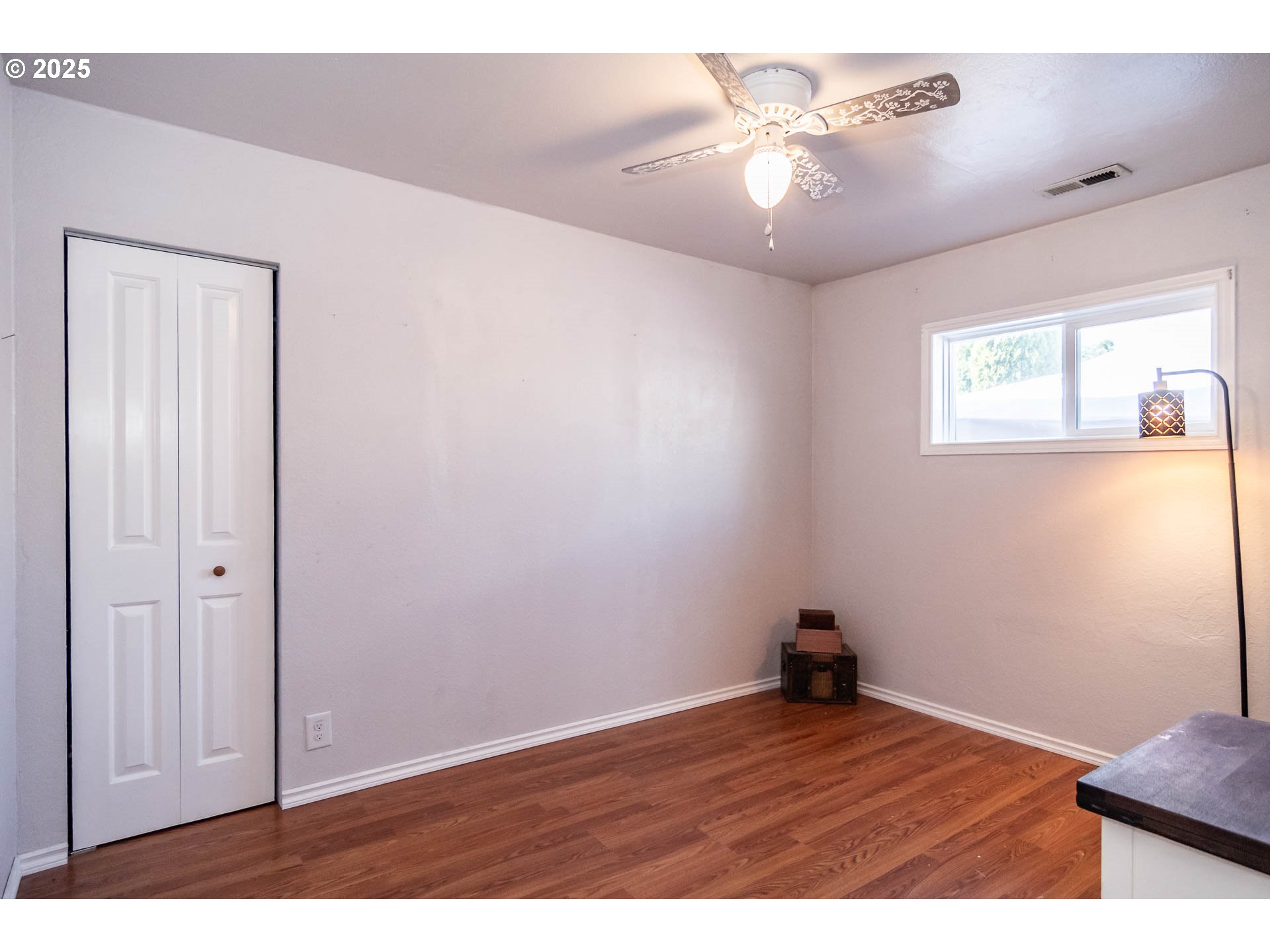 68 Rose Avenue Winston, OR 97496 - Photo 20 of 43 a view of an empty room and window and a ceiling fan