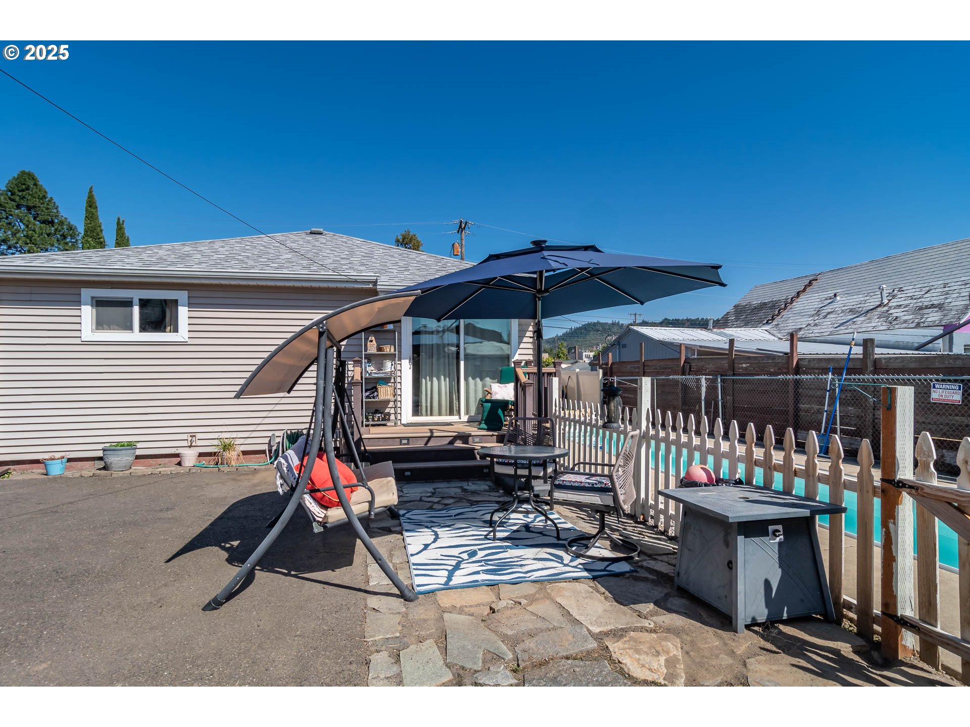 68 Rose Avenue Winston, OR 97496 - Photo 30 of 43 a view of a chairs and table in backyard