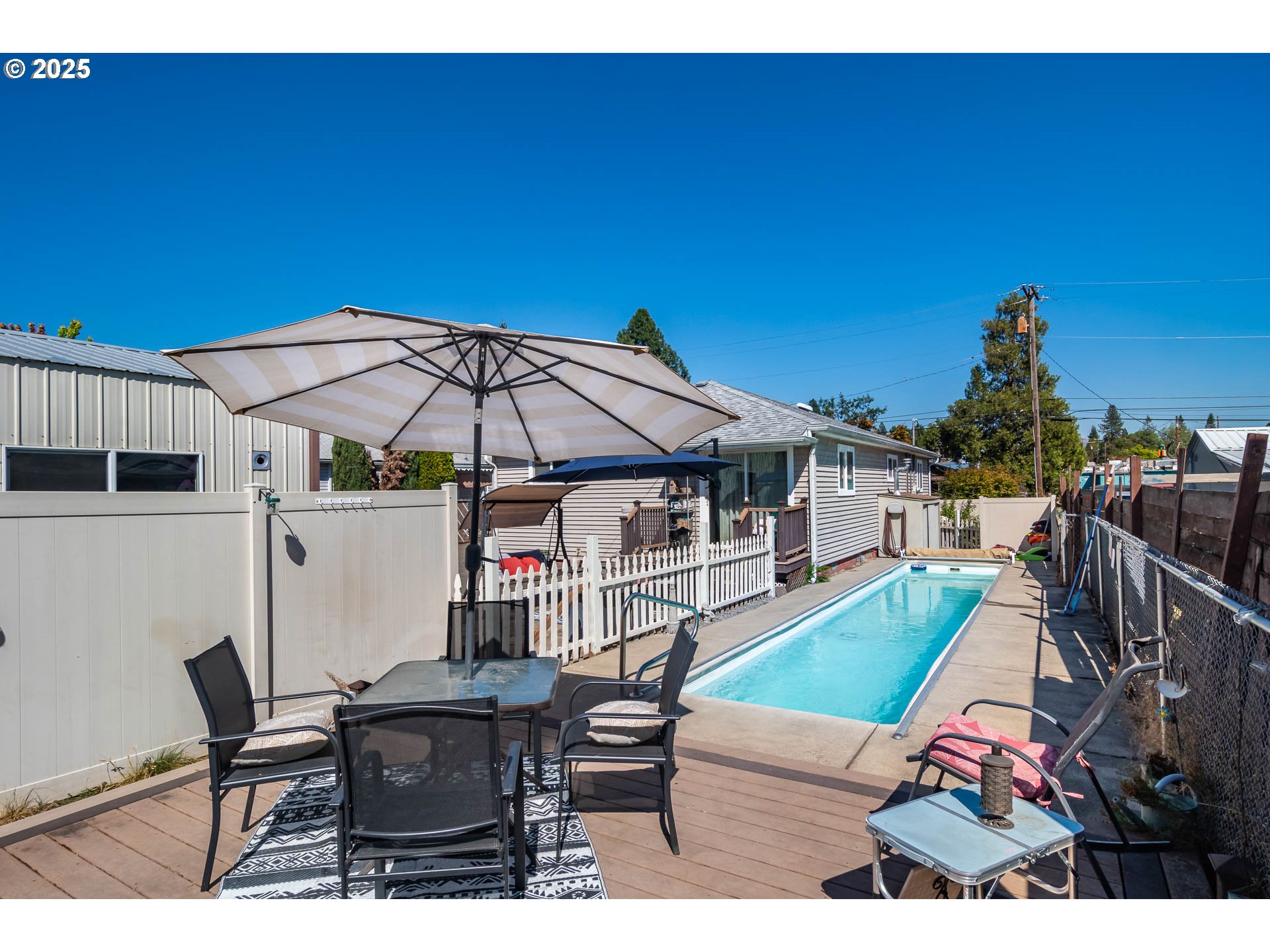68 Rose Avenue Winston, OR 97496 - Photo 3 of 43 a sitting area with furniture and wooden floor