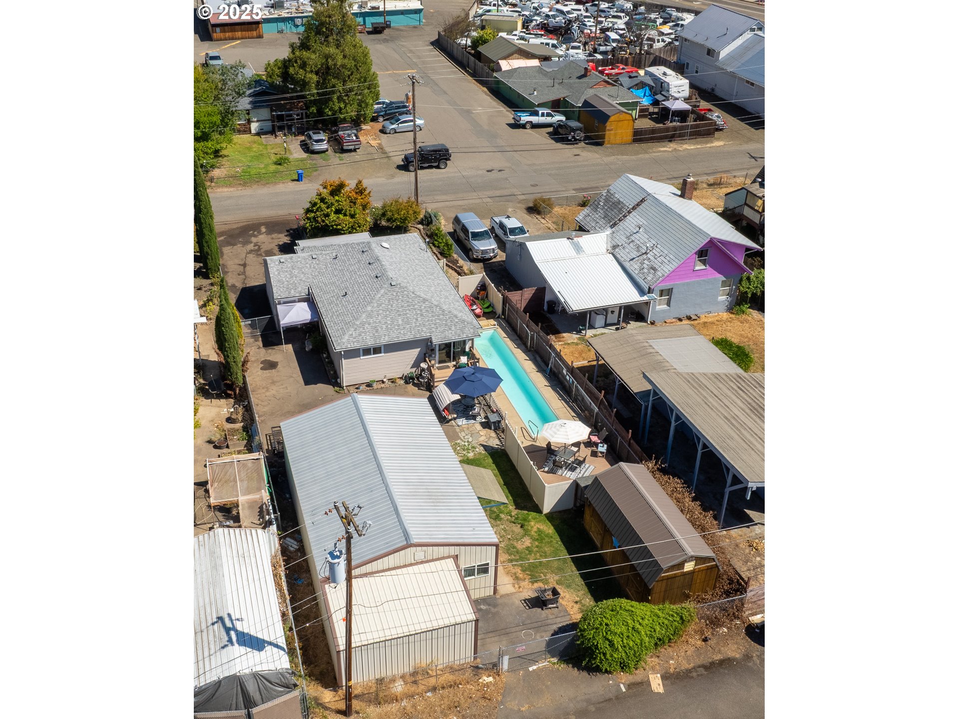 68 Rose Avenue Winston, OR 97496 - Photo 39 of 43 an aerial view of a house with a yard and parking