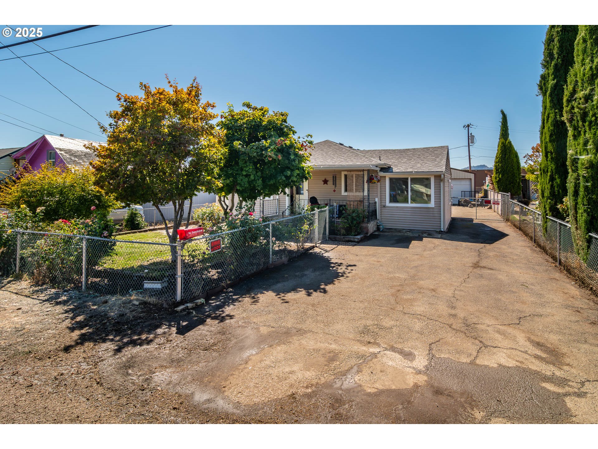68 Rose Avenue Winston, OR 97496 - Photo 6 of 43 a backyard of a house with barbeque oven fire pit table and chairs
