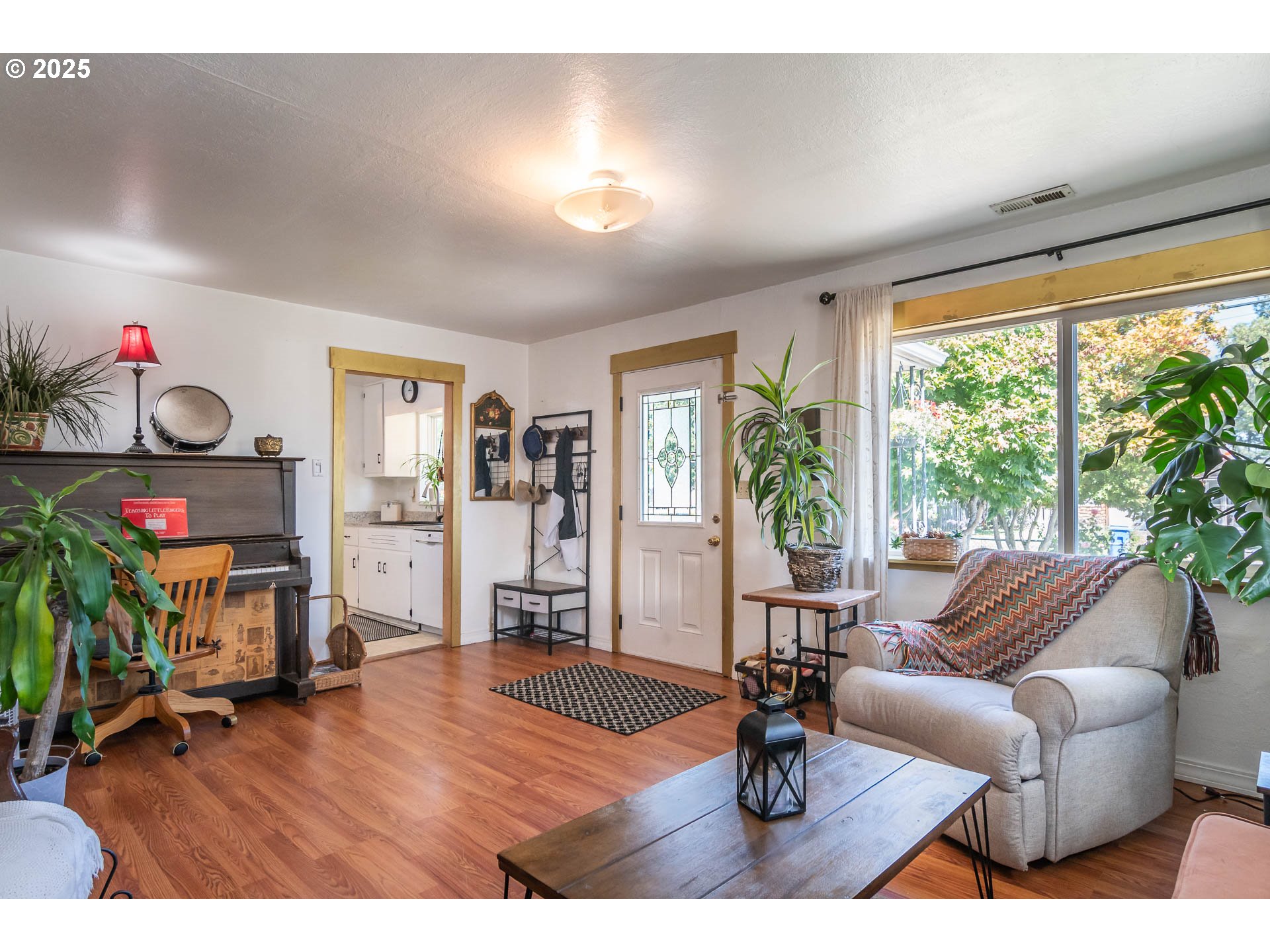 68 Rose Avenue Winston, OR 97496 - Photo 8 of 43 a living room with furniture and a floor to ceiling window