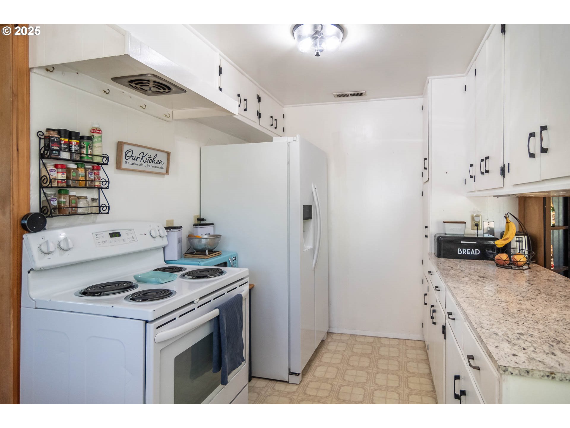 68 Rose Avenue Winston, OR 97496 - Photo 9 of 43 a kitchen with stainless steel appliances granite countertop a stove and a refrigerator