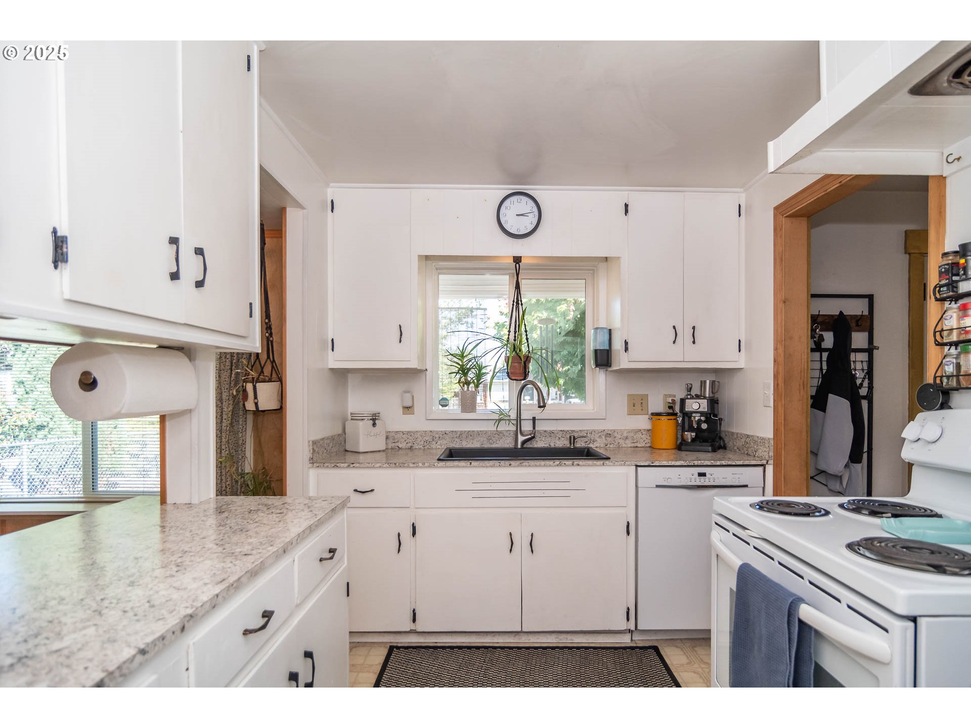 68 Rose Avenue Winston, OR 97496 - Photo 10 of 43 a kitchen with white cabinets and window