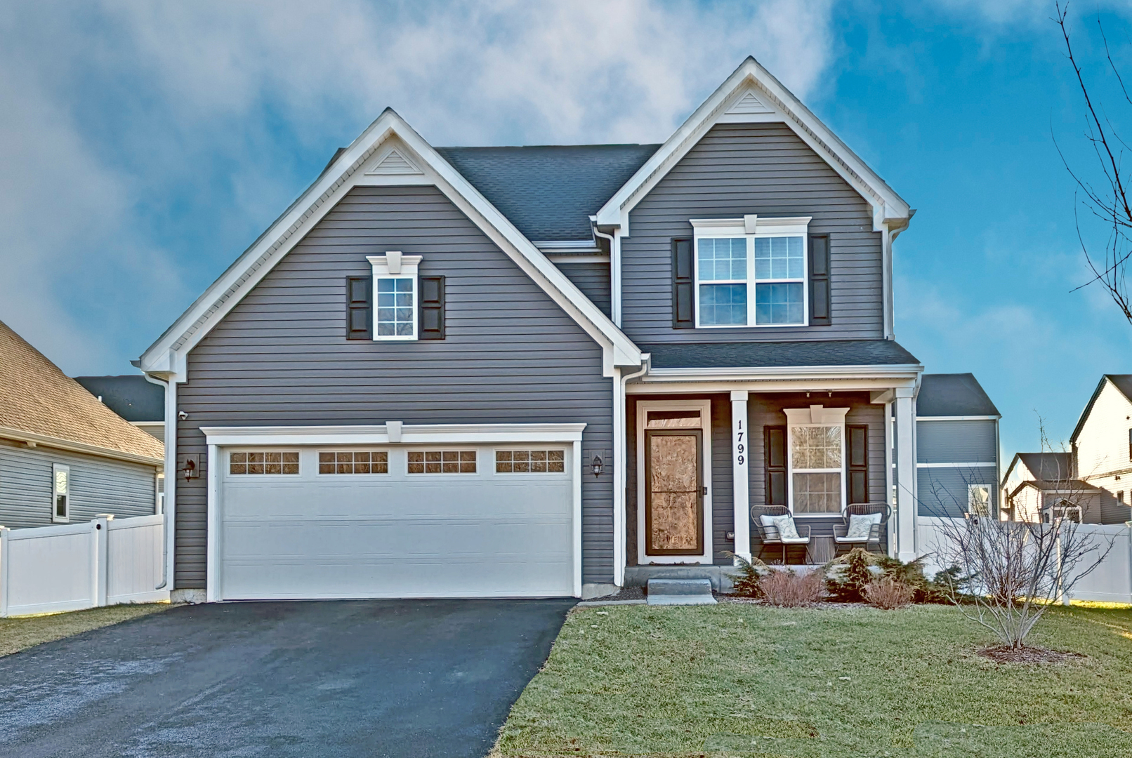 a front view of a house with a yard