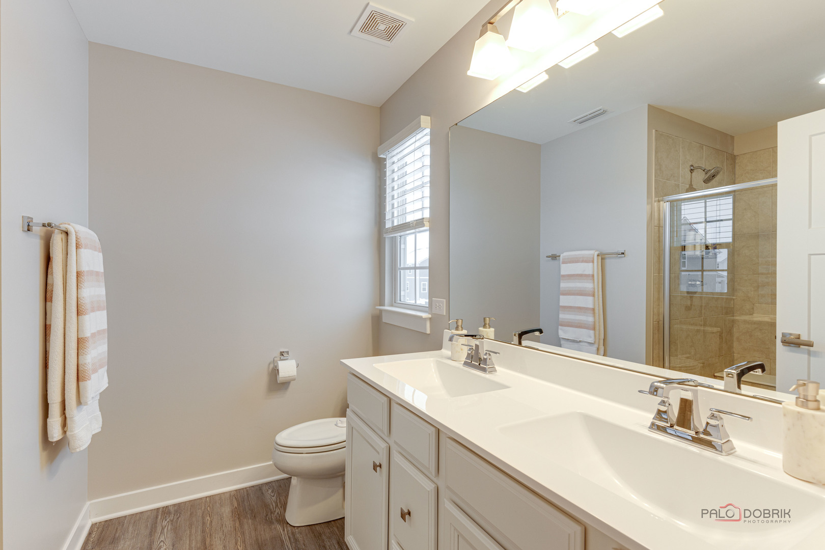 1799 Overview Circle Antioch, IL 60002 - Photo 24 of 38 a bathroom with a double vanity sink toilet and a mirror