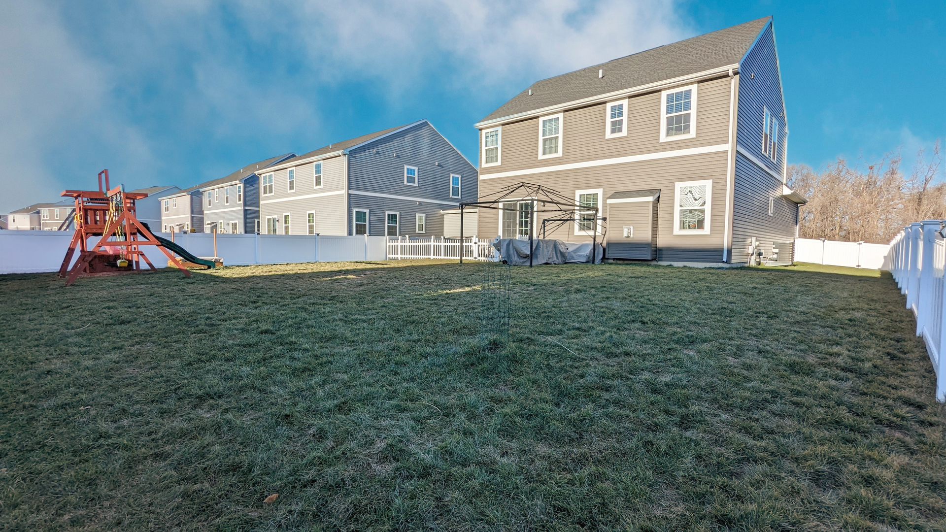 1799 Overview Circle Antioch, IL 60002 - Photo 34 of 38 a view of a big house with a big yard and large trees