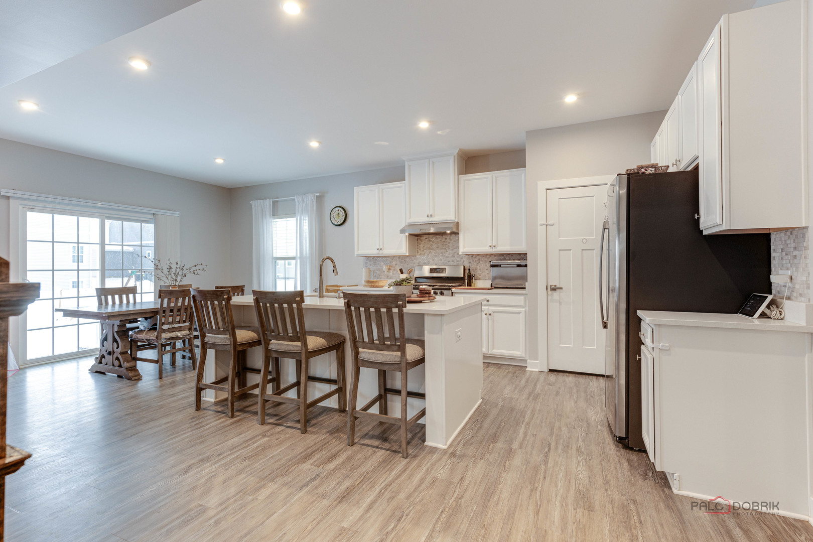 1799 Overview Circle Antioch, IL 60002 - Photo 7 of 38 a kitchen with white cabinets and stainless steel appliances