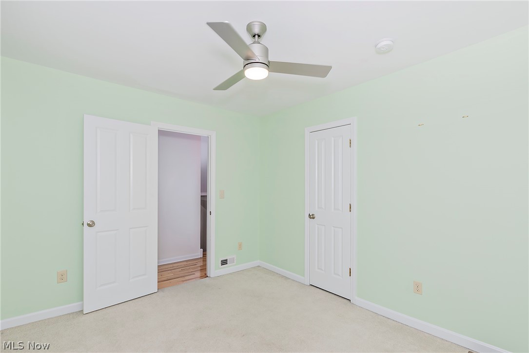 917 Brunswick Road Cleveland Heights, OH 44112 - Photo 25 of 42 Bedroom one with closet, ceiling fan and great natural light.