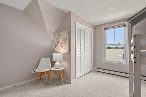 a view of room with furniture and a window