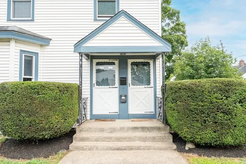 a view of a house with a garden
