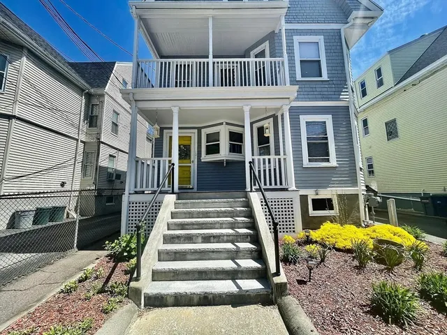 a front view of a house with a swimming pool