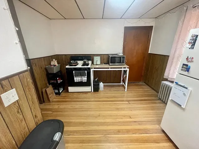 a view of living room with furniture and a flat screen tv