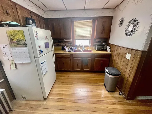 a kitchen with stainless steel appliances a stove a refrigerator and a refrigerator