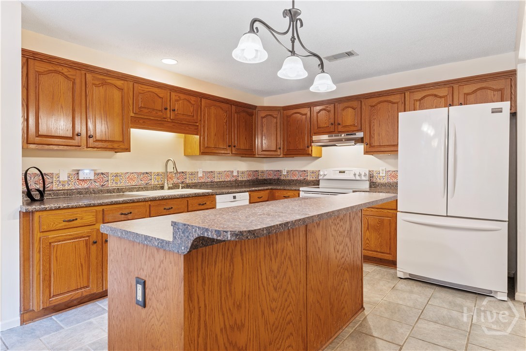 131 Crystal Drive Rincon, GA 31326 - Photo 5 of 51 Tons of cabinets and a spacious island