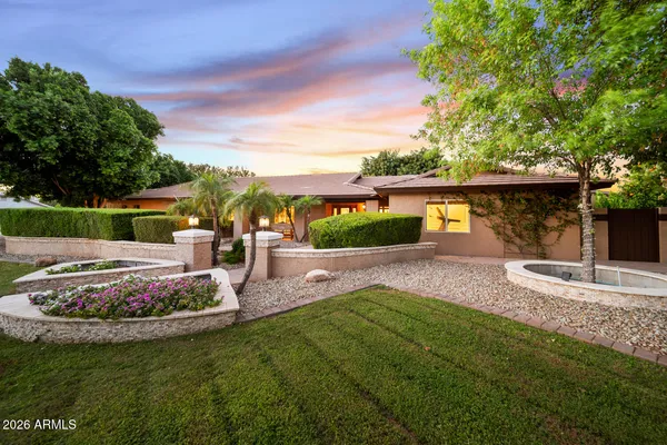 a view of a patio with table and chairs