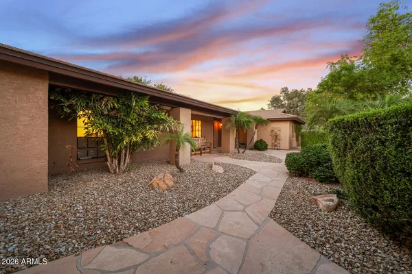 a bathroom with a shower sink and mirror