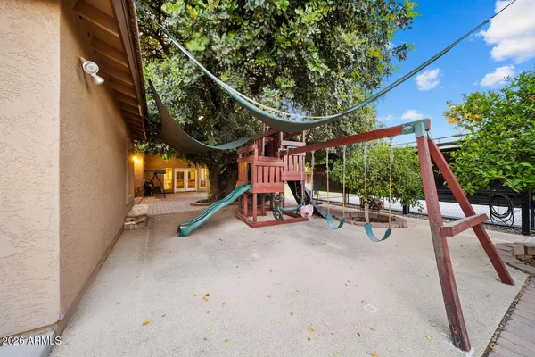 a living room with furniture pool table and a large window