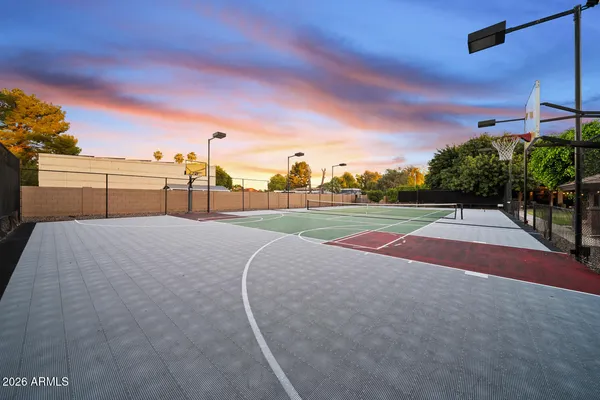 a view of a livingroom with workspace and a window