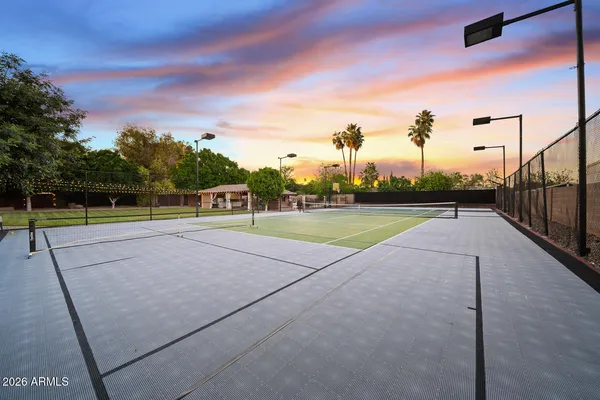 a spacious bathroom with a sink a toilet and a shower