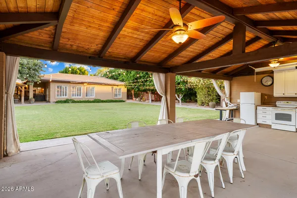 a kitchen with stainless steel appliances granite countertop a kitchen island a stove and a sink